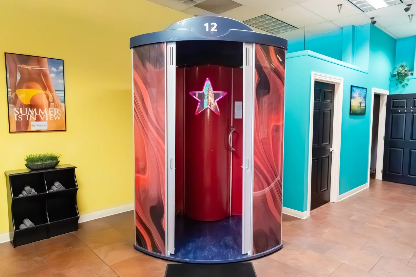 A red and black round booth with a star on it.