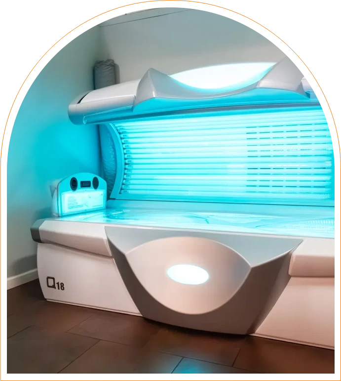 A tanning bed with blue lights in the middle of it.